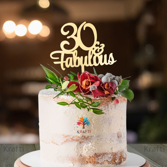 30 Fabulous gold acrylic 30th birthday cake topper displayed on a decorated celebration cake