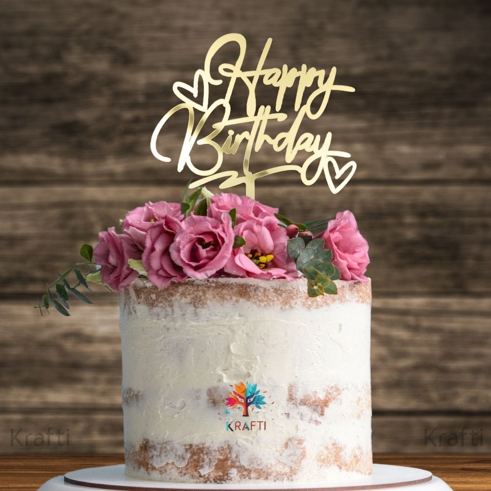 Gold acrylic Happy Birthday cake topper with heart design on decorated birthday cake, stylish cake decoration