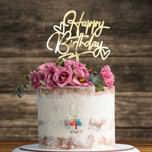 Gold acrylic Happy Birthday cake topper with heart design on decorated birthday cake, stylish cake decoration
